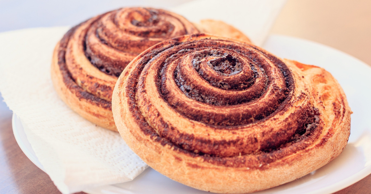 Two cinnamon roles on a plate