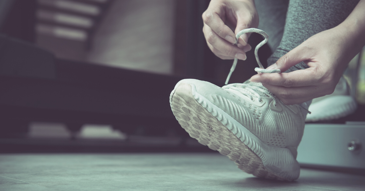 Lacing up running shoe for a workout