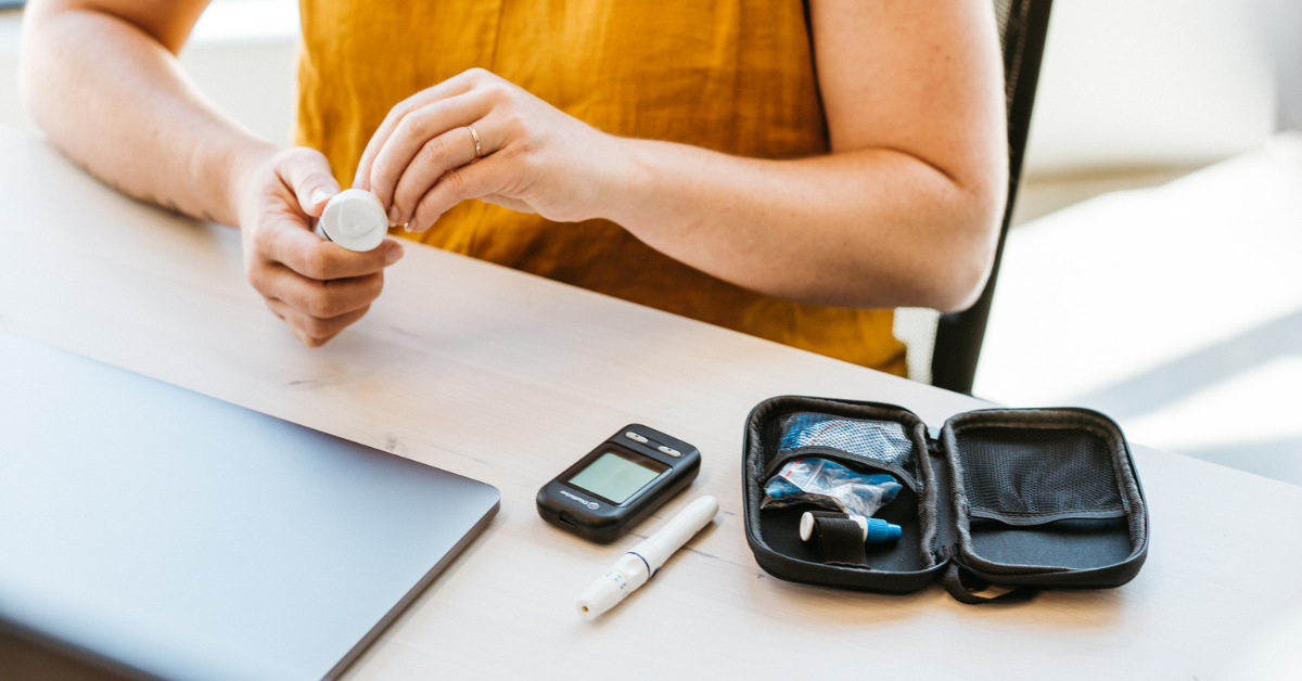 Office worker preparing to check blood sugar