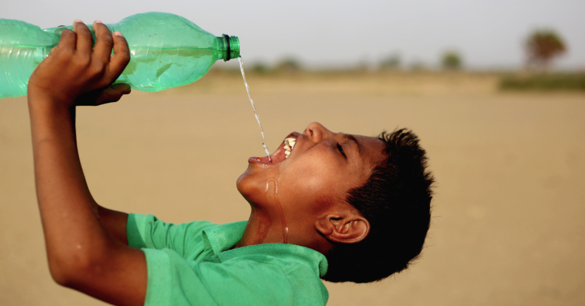 Young boy drinking 2 liters of water