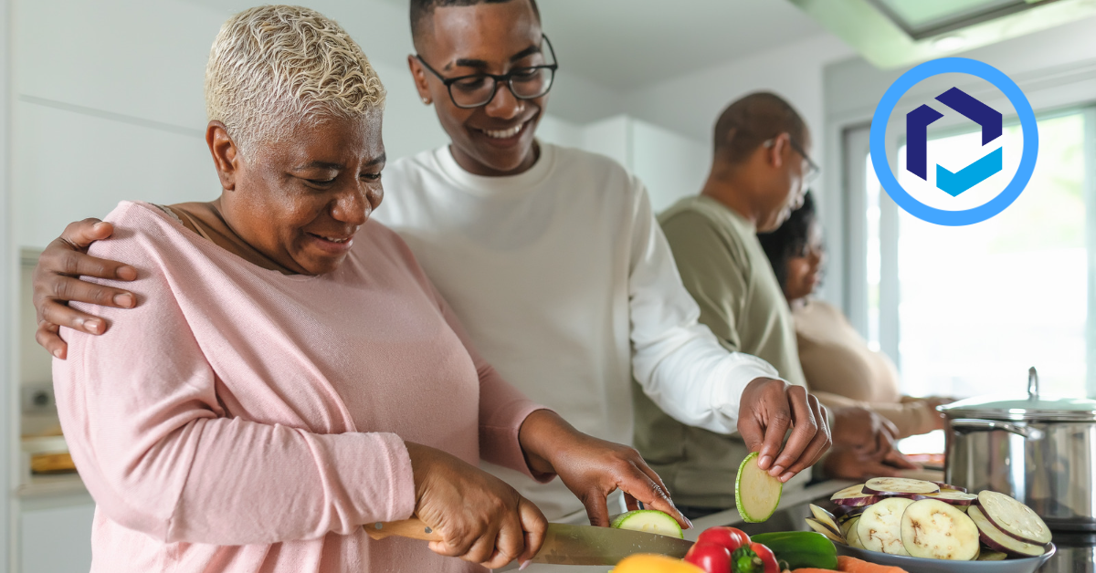 Family cooking eggplant and bell peppers together