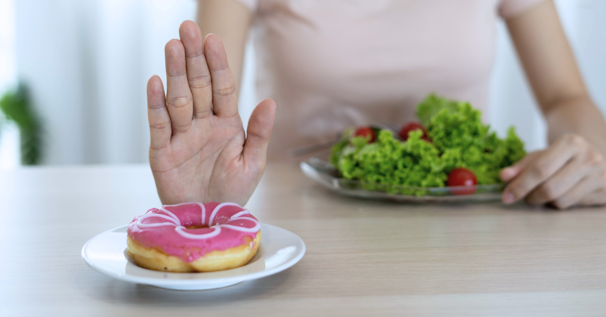 A person refuses a donut
