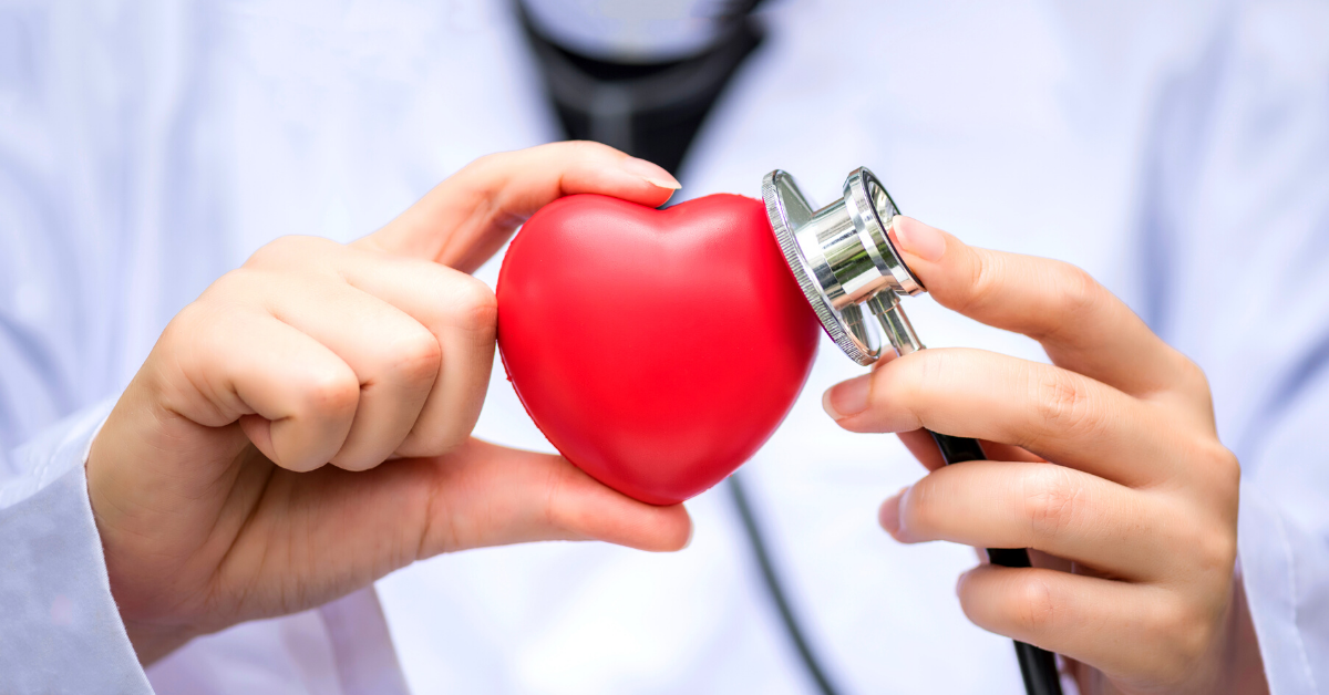 Doctor with stethoscope listening to heart