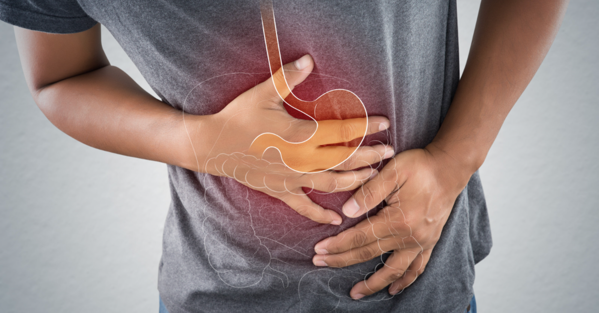 Person holding their gut with stomach illustration overlay