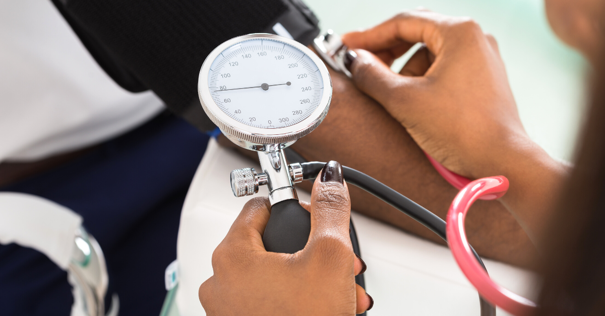 Doctor checking blood pressure