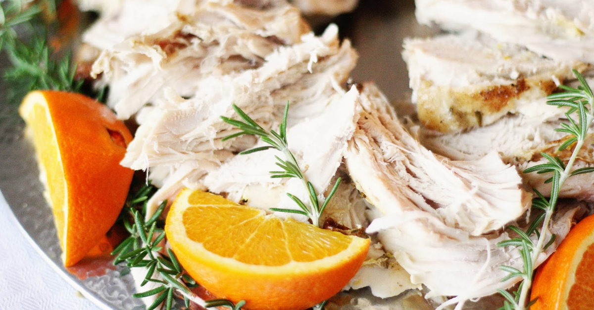 Turkey, oranges and rosemary arranged on a platter