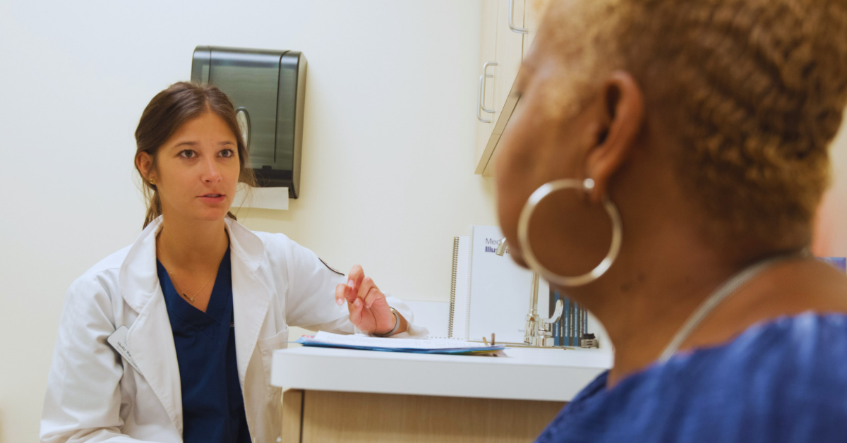 Woman receiving diagnosis from a doctor