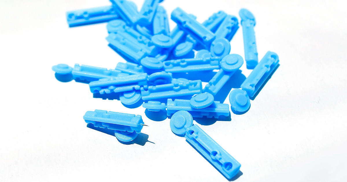 A pile of blue lancets